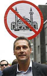 Heinz-Christian Strache with anti-mosque placard