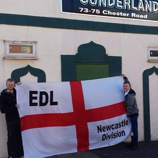Connor McIntosh with EDL banner outside Mosque of Sunderland