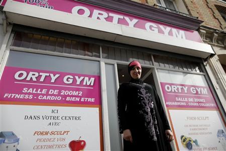 Orty Gym owner Lynda Ellabou poses in font of her new all-women's gym on the outskirts of Paris, in Le Raincy