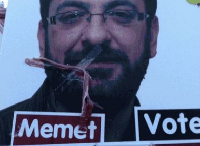 Memet Uludag poster defaced with bacon