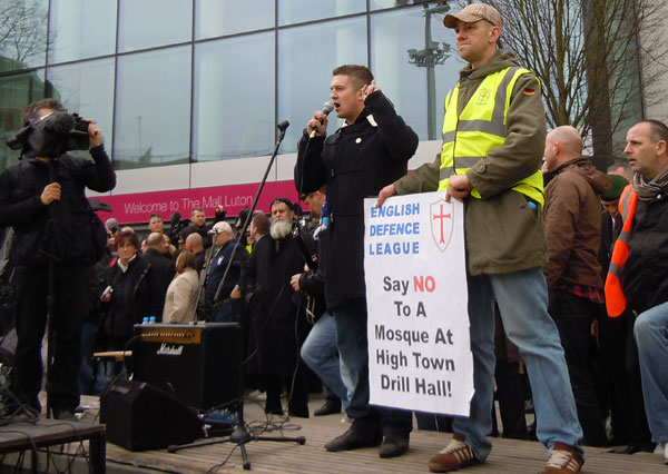 Stephen Lennon with anti-mosque placard