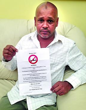 Tahirul Hasan with anti-mosque leaflet